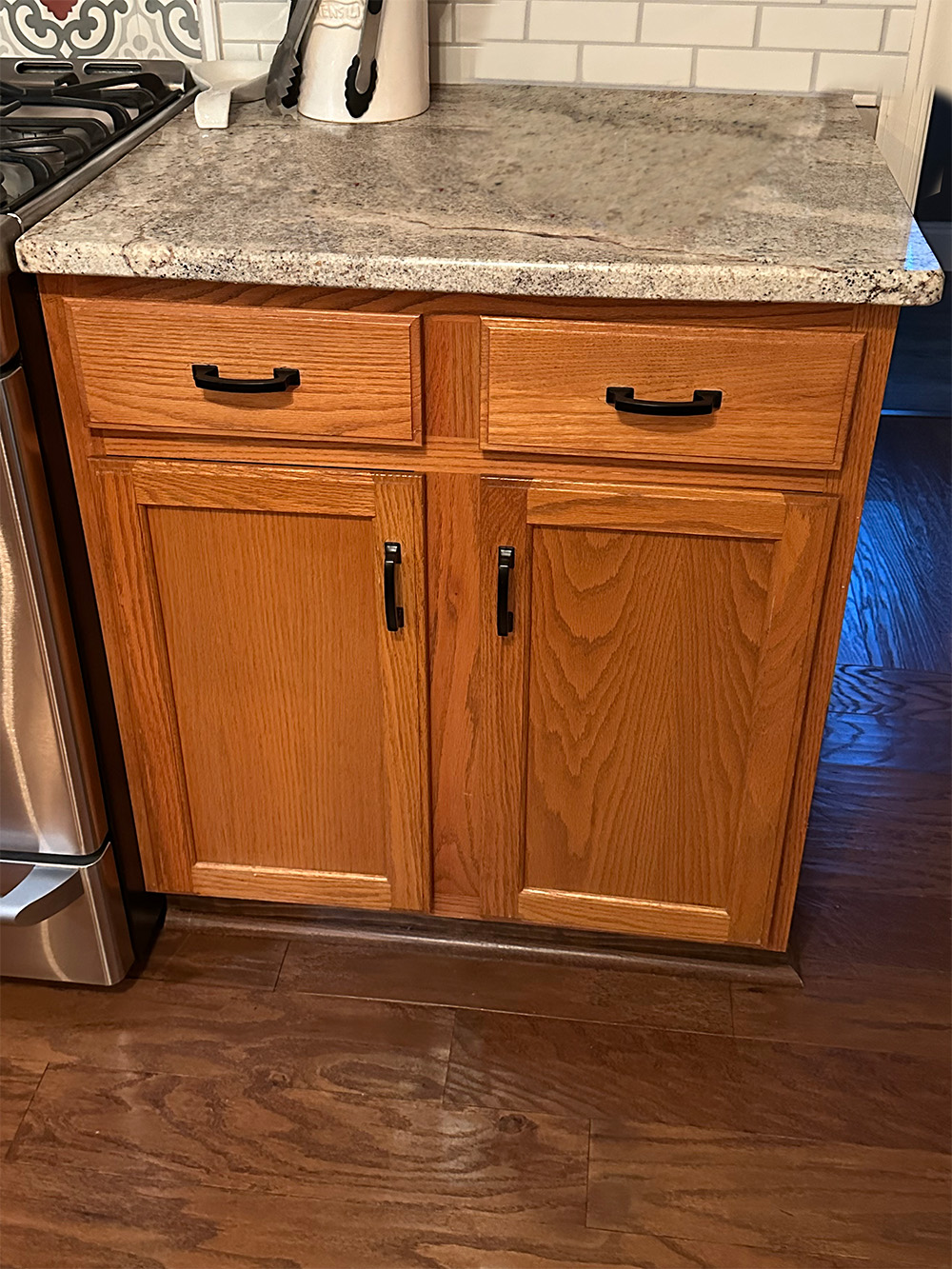Before- Kitchen cabinets with two swing doors