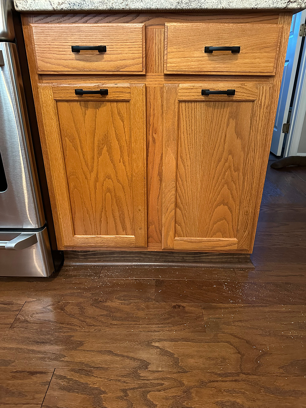 After- Cabinet pull handles moved to top of doors, doors closed