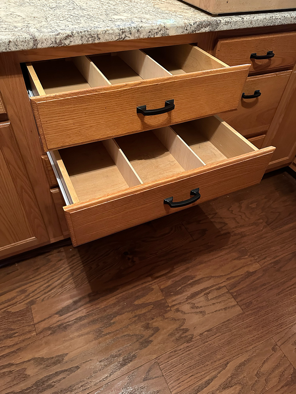 After-Kitchen microwave cabinet drawers opened
